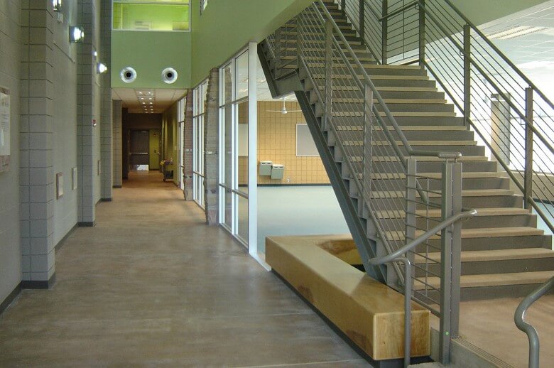 An interior hallway and staircase created by the architectural design team at Swaim Associates