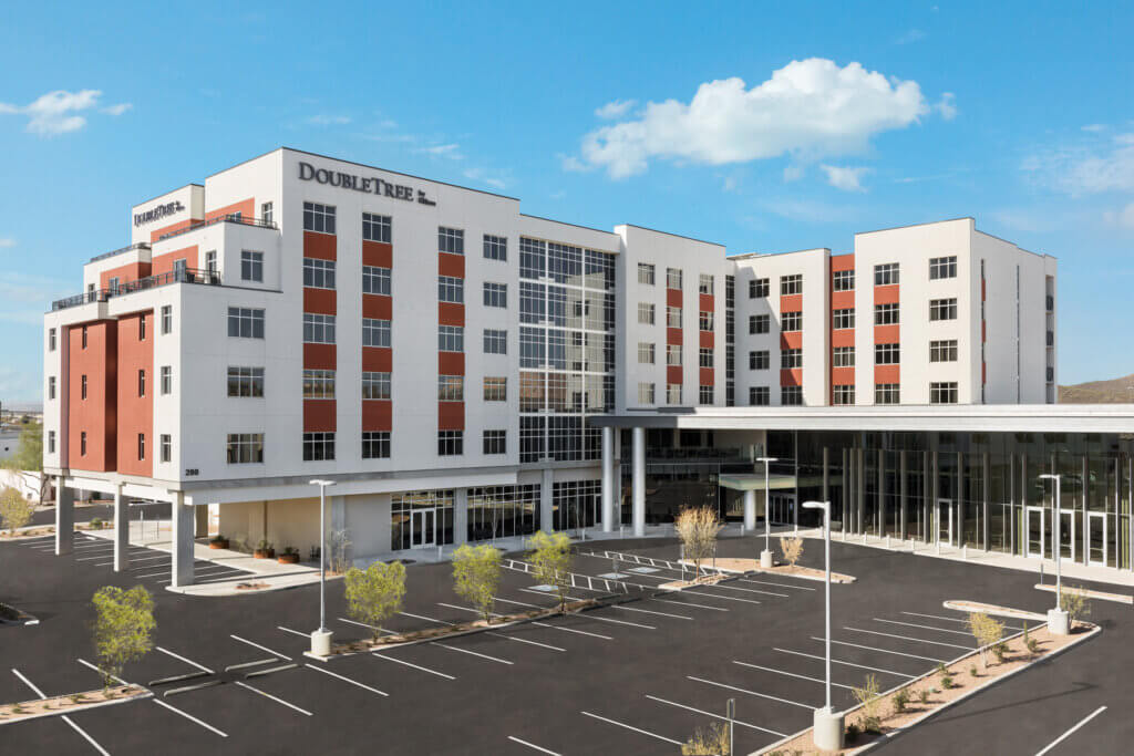 The parking lot and front of a Double Tree hotel where the architectural design was provided by Swaim Associates
